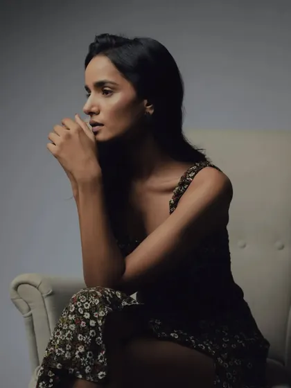 A pensive profile, where the lighting highlights the natural contours of the face, enhanced by my subtle makeup application.