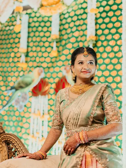 A portrait of a bride on her engagement day, looking up with a gentle smile.