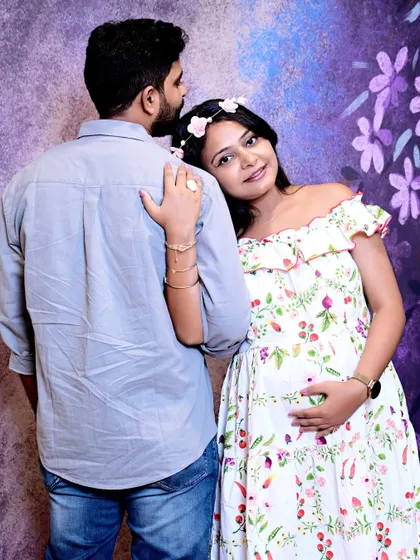 Capturing the intimate bond between partners during a maternity shoot. The way she rests her head on his shoulder shows their connection and shared excitement.