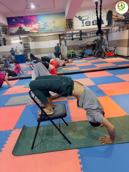 Another example of a supported backbend, this time with the head on the mat. This variation of Chakrasana (Wheel Pose) is great for building confidence and strength for the full pose.
