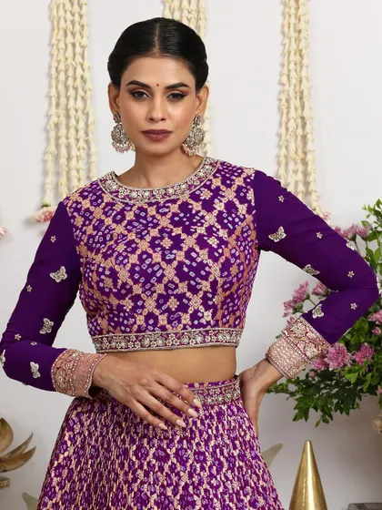 A close-up of the full-sleeved purple blouse, featuring delicate butterfly embroidery.