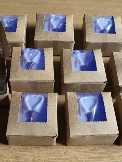 Packaging some shirt-and-tie soaps for an event. These are a popular choice for corporate gifts and Father's Day.