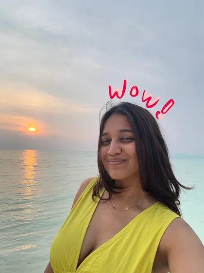 A sunset selfie in Lakshadweep with a simple "wow" doodle to express the feeling of the moment.