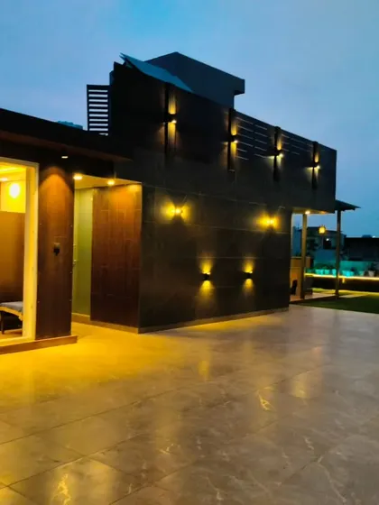 A completed office cabin on the Sushant Lok terrace. The glass walls provide ample natural light, creating a perfect work-from-home environment.