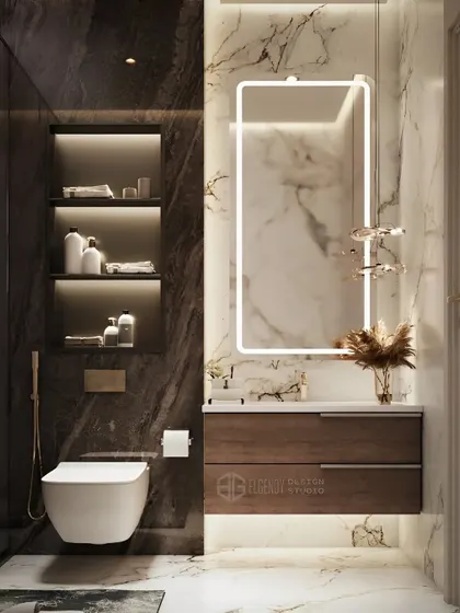 A luxurious bathroom design with floor-to-ceiling marble tiles. The floating toilet, backlit rectangular mirror, and built-in shelving create a sleek, high-end hotel feel.