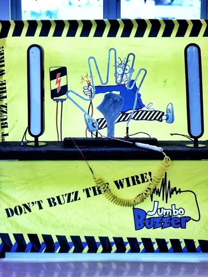 The "Don't Buzz the Wire" game, a classic arcade challenge, provided hours of fun and friendly competition at our Rockstar-themed event.