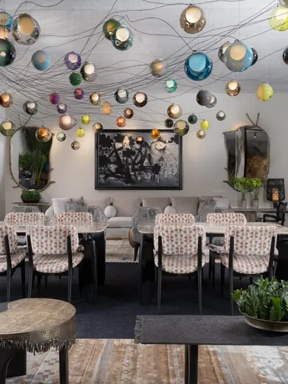 A stunning installation of Bocci lights cascades over the dining area in the VIP Lounge. This feature added a sense of magic and artistry to the space, creating a memorable experience for all visitors.