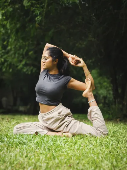 Eka Pada Rajakapotasana, or One-Legged King Pigeon Pose. This deep stretch opens the hips and chest, releasing emotional tension and improving flexibility.