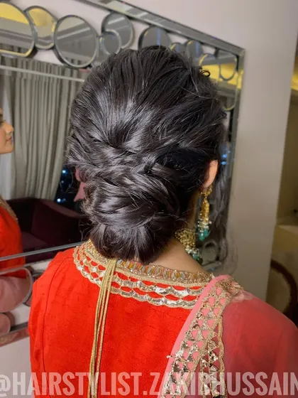 A textured, braided updo that is both intricate and soft. This style is perfect for someone who wants a unique but not overly formal look.