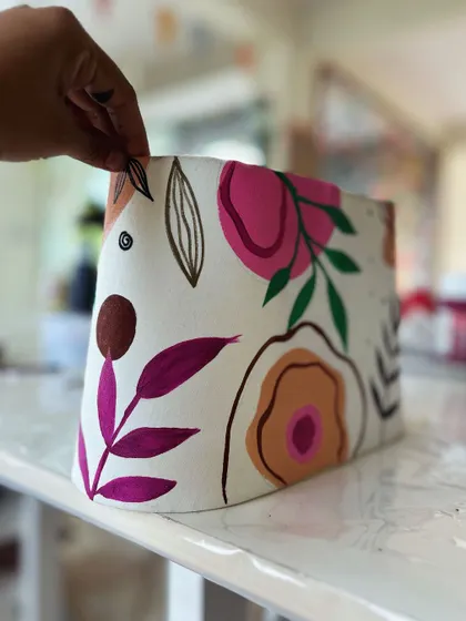 A close-up of a beautiful, hand-painted botanical lampshade. This is one of the functional art pieces you can create with me.
