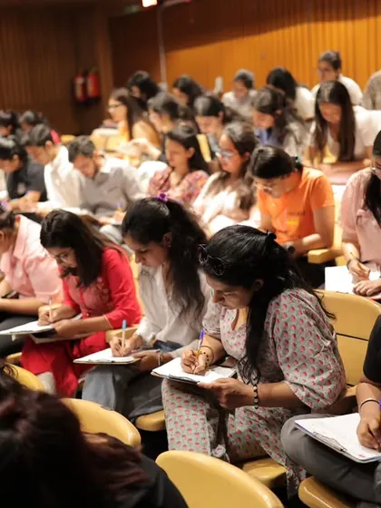 Students concentrate on their writing during the French dictation event. "La Dictée pour Tous" is a wonderful challenge that brings together learners of all levels.