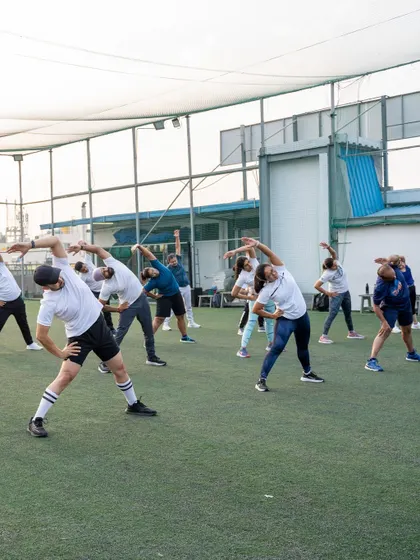 A duplicate of the group stretching on the rooftop, emphasizing the community aspect of our bootcamps.