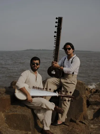 On the rocks by the sea with Pratik Shrivastava for our "Strings of Serenity" photoshoot. This image captures the blend of tradition and modern style that defines our collaboration.