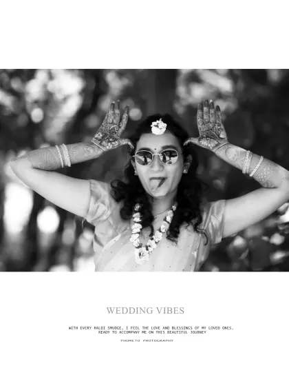 A fun, quirky black and white photo that captures the bride's playful spirit and the celebratory wedding vibes.