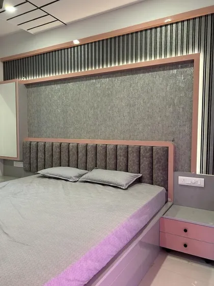 This angle shows the integrated dressing table with a mirror, seamlessly built into the wall paneling next to the bed.