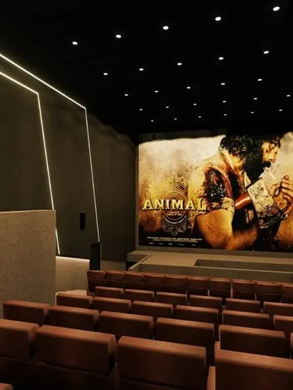 A design concept for a modern multiplex, featuring clean lines, integrated LED lighting, and a large, high-contrast screen.