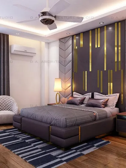 This bedroom design features a dramatic headboard with gold metallic inlays and quilted side panels, creating a look of pure luxury.