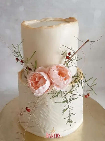 This rustic peach and ivory engagement cake was based on a design the client loved. The torn-edge effect and delicate floral arrangement create a beautifully textured, organic look. This no-fondant cake was a vanilla and coffee flavor.