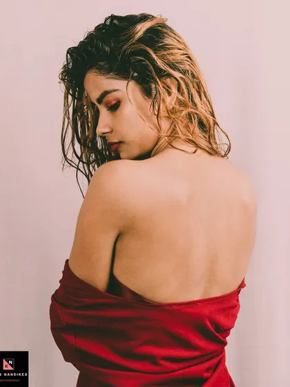 A back-focused shot from the 'Depression' series. The model looks over her shoulder, her pose and the desaturated tones creating a powerful image of hidden pain and resilience.