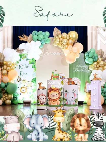 Nirvaan's "Wild One" safari party was both elegant and adorable. We used a sophisticated palette of sage green, gold, and white balloons, paired with cute cartoon animal props and a light up number '1'.