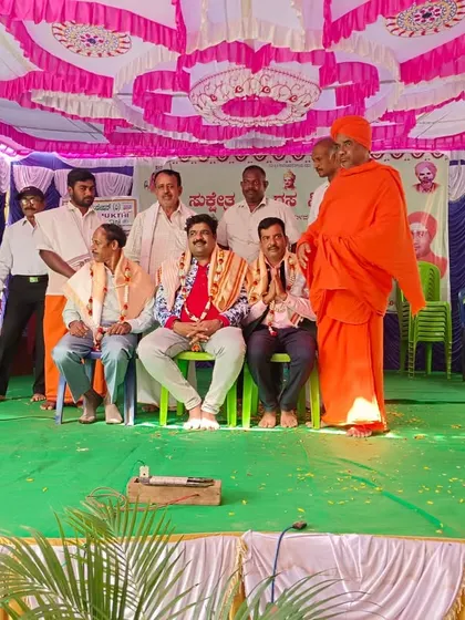 On stage with the organizers and a swami-ji at a local event. Receiving blessings from elders is very important to me.