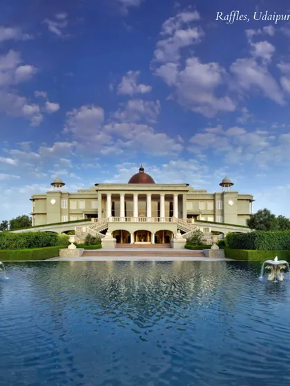 The magnificent facade of Raffles, Udaipur, set against a vast pool. This venue exudes a sense of grandeur and exclusivity, perfect for a high-end luxury wedding.