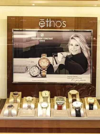 A close-up of a backlit watch display case. Proper lighting is critical in luxury retail, and we pay close attention to ensuring products are showcased perfectly.