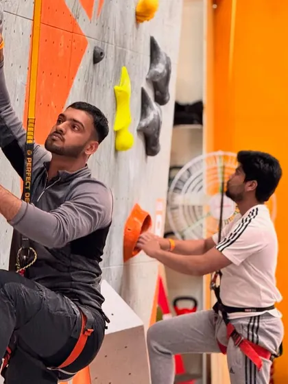 Two climbers race side by side on our auto-belay walls during the Speed Climbing competition. It's a thrilling head to head battle against the clock.