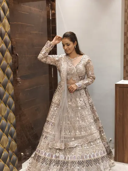 Another shot of the client in the tiered lehenga, showing its elegant design.