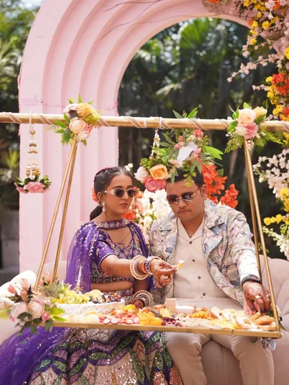 A unique way to serve, this suspended tray brings a platter of delicious food directly to the guests of honor. It's a special touch for a special occasion.