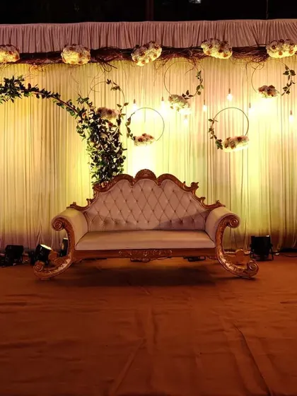 A full view of the rustic romantic reception stage. The warm lighting and natural textures create an inviting and beautiful focal point for the evening's celebration.