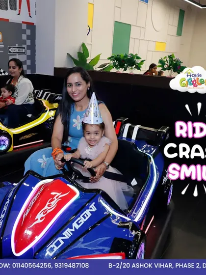 Ride, crash, smile, and repeat! A mother and daughter are all set for their bumper car adventure, complete with a party hat. It's the perfect way to add some thrill to any celebration.