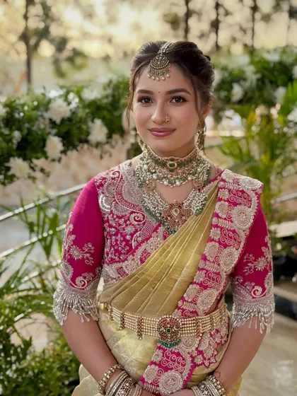 It's a joy to create looks for the entire bridal party. Here, the bride's sister, Gowthami, is a picture of grace, with a look that complements the bride's while celebrating her own style for the Muhurtham.
