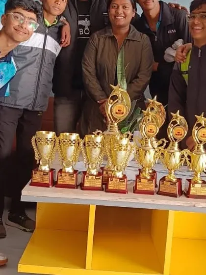 A table full of trophies from the Haryana District Tournament. This image represents the collective success of our team and the winning culture we cultivate at the academy.