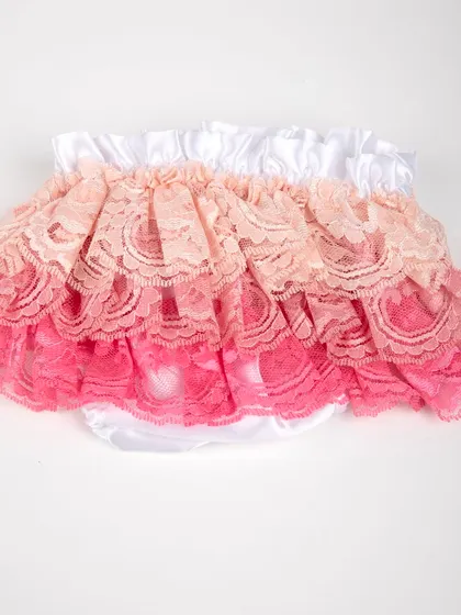 A product shot of the ruffled lace diaper cover in shades of pink and peach.