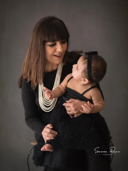 A beautiful moment between a grandmother and her granddaughter. The way they are looking at each other is just filled with love.