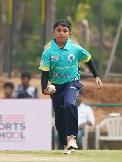 A young fielder runs in to stop the ball, showing the agility and commitment we instill in our players.