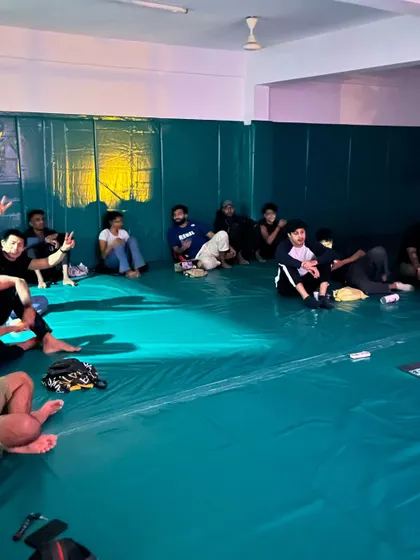 Chilling on the mats after the main event. Our UFC 308 watch party was a blast.