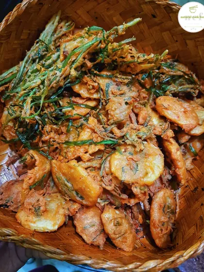 A basket of 'Bora krem krem', which means extra crispy fritters. I make them with various greens and vegetables.