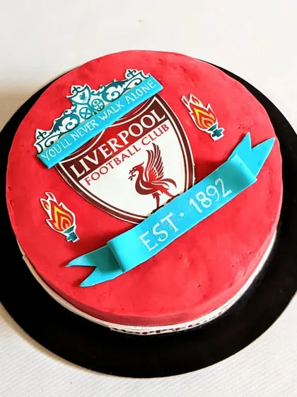 A cake for a Liverpool FC fan, featuring the club's crest and colors. A great way to celebrate a birthday for a dedicated football supporter.