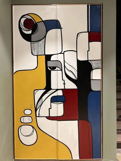 The final, fully assembled wardrobe. The design flows seamlessly across the two doors, creating a single, cohesive piece of art.