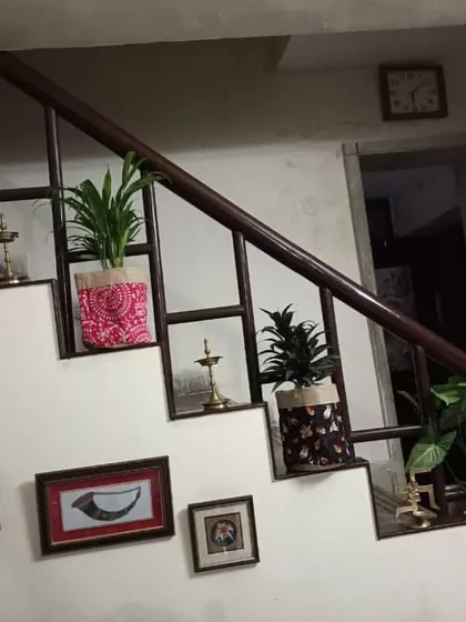 I love using unexpected spaces. Here, I've decorated a staircase with a series of beautiful plants in ethnic printed grow bags, turning a simple passageway into a decorative feature.