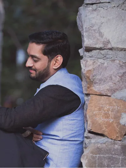 A solo portrait of the groom, looking thoughtful and happy. It’s important to capture individual personalities during a pre-wedding shoot as well.
