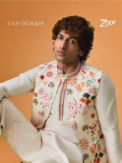 This floral embroidered Nehru jacket is another highlight from our Vanderphool collection. The intricate design transforms the entire outfit into a work of art.