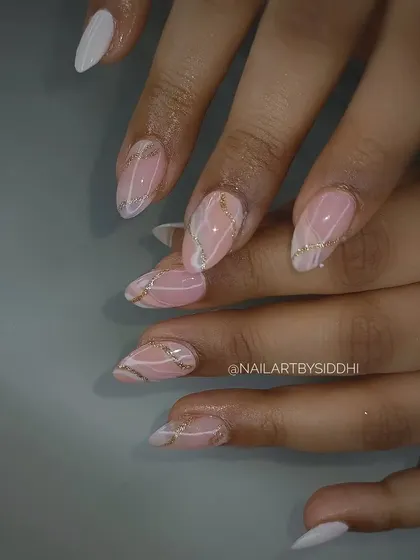 A beautiful abstract design combining a soft pink marble effect with elegant white and gold swirls.