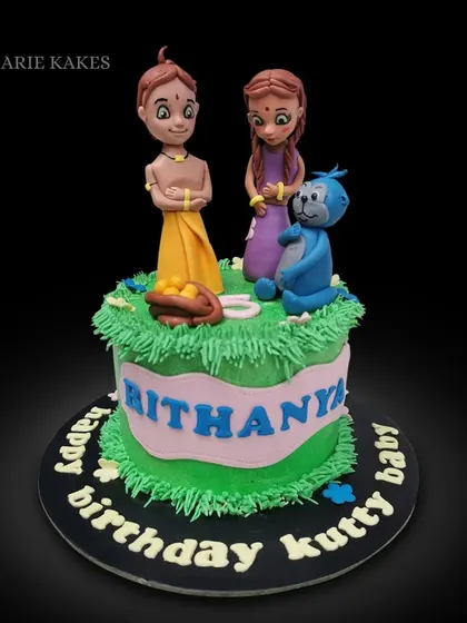Can you guess these characters? This cake features hand-sculpted fondant figures from a popular Indian animation, set on a grassy green buttercream base.