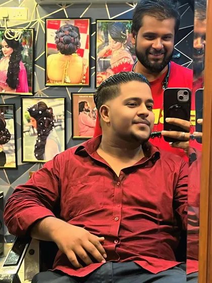 A mirror selfie with a happy client after his haircut. It's always great to see clients feeling confident with their new style.