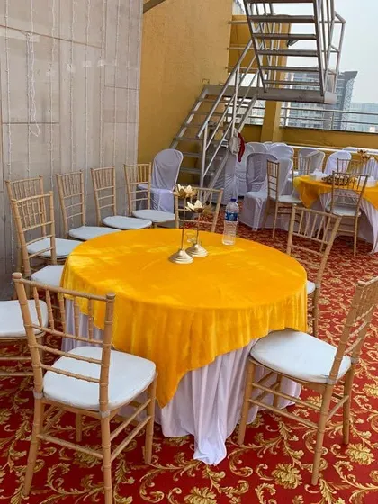Terrace decoration for a wedding function in Bandra, Mumbai. We provide complete furniture solutions including round tables with covers and chairs.