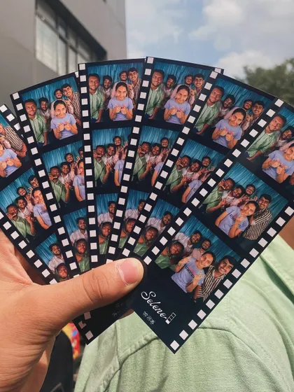 A fan of colorful photo strips with a film border, showing how many fun moments can be captured in one event.