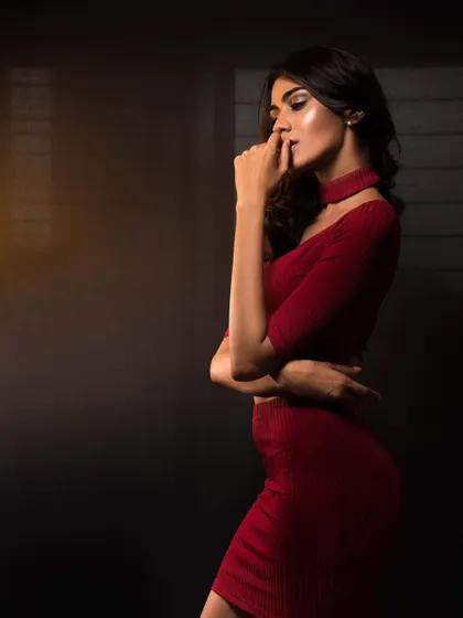A Christmas-themed shoot with Apeksha Porwal. I styled her in a chic red coordinated set with a choker, using moody lighting to create an intimate and sophisticated portrait.